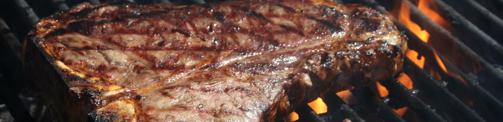 t-bone steak on the grill