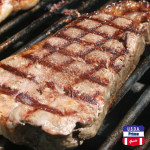 USDA Prime New York Strip Steak on the grill